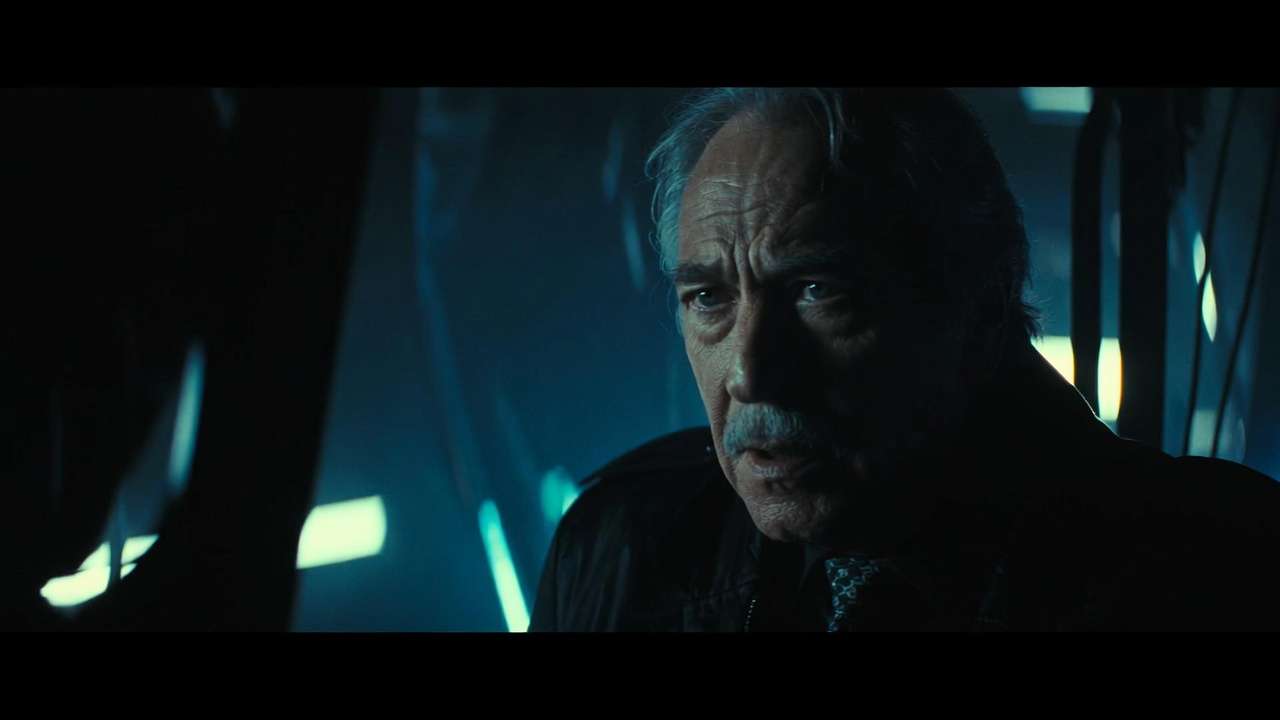 Dramatic close-up of older man with grey hair, cool blue side lighting, film noir atmosphere